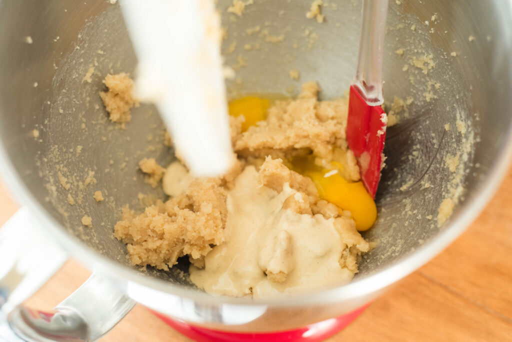 eggs and sourdough starter added to wet cookie dough ingredients