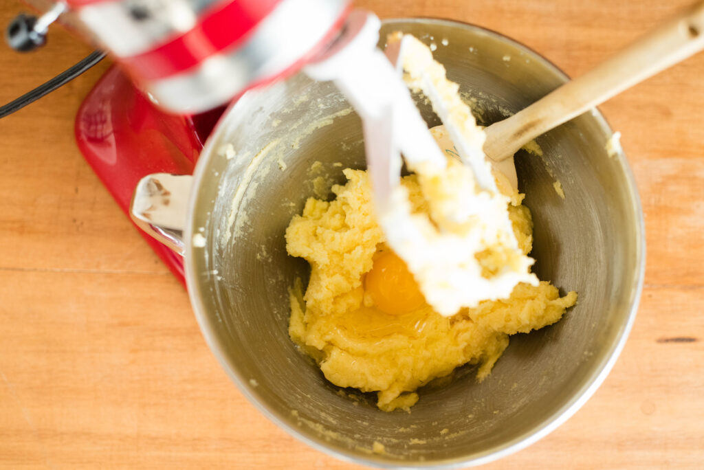 eggs added to creamed butter and sugar in a stand mixer