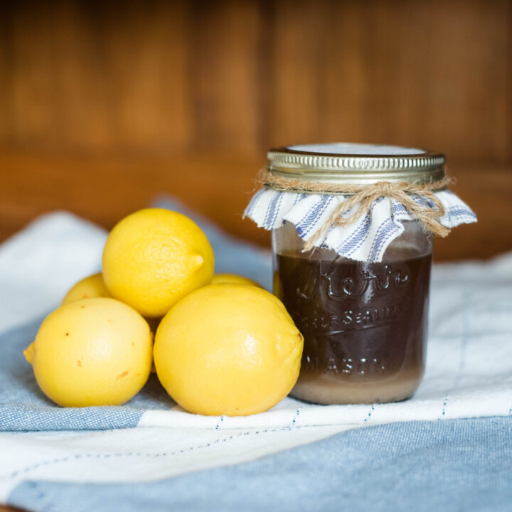jar of homemade pectin with whole lemons
