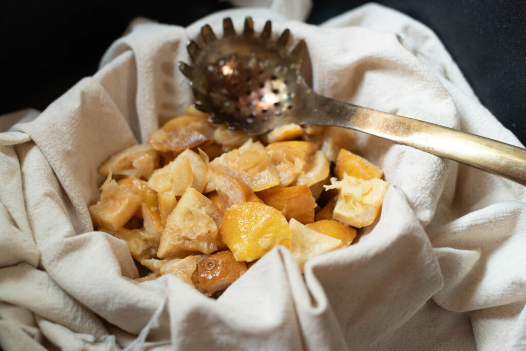 homemade lemon pectin mixture in a  muslin cloth