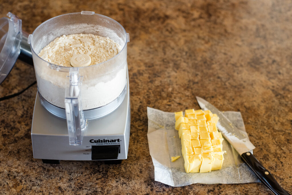 Flour mixture in food processor and butter cut into cubes