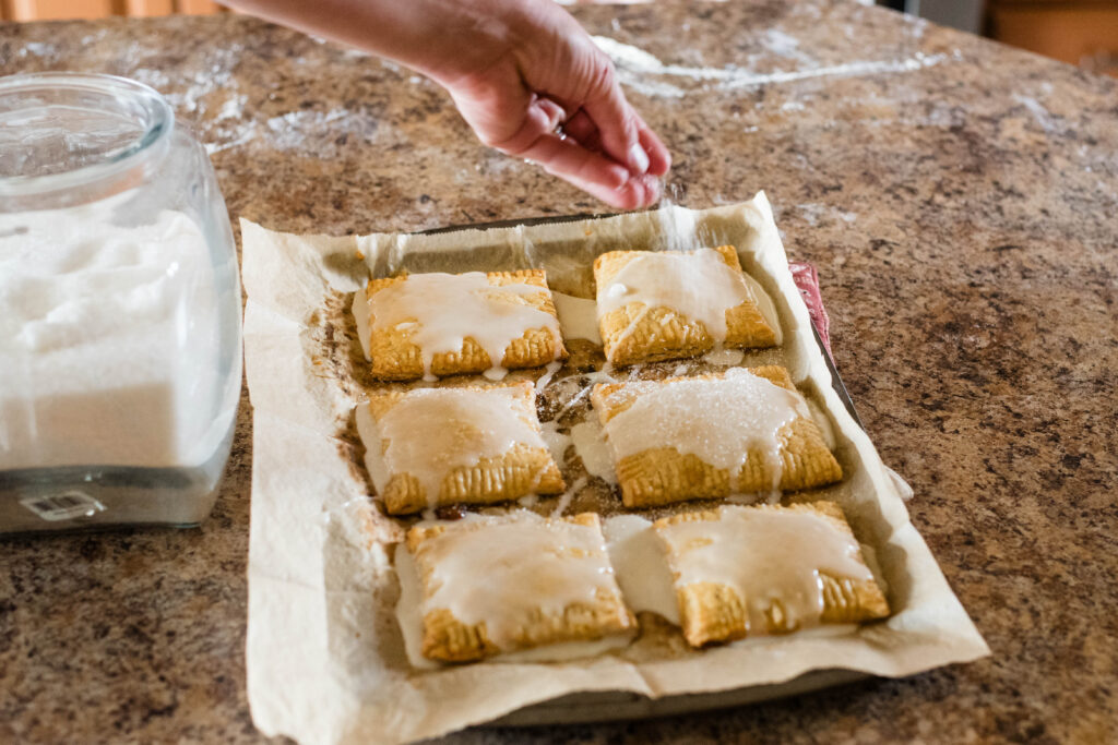 Sugar sprinkled onto warm hand pies