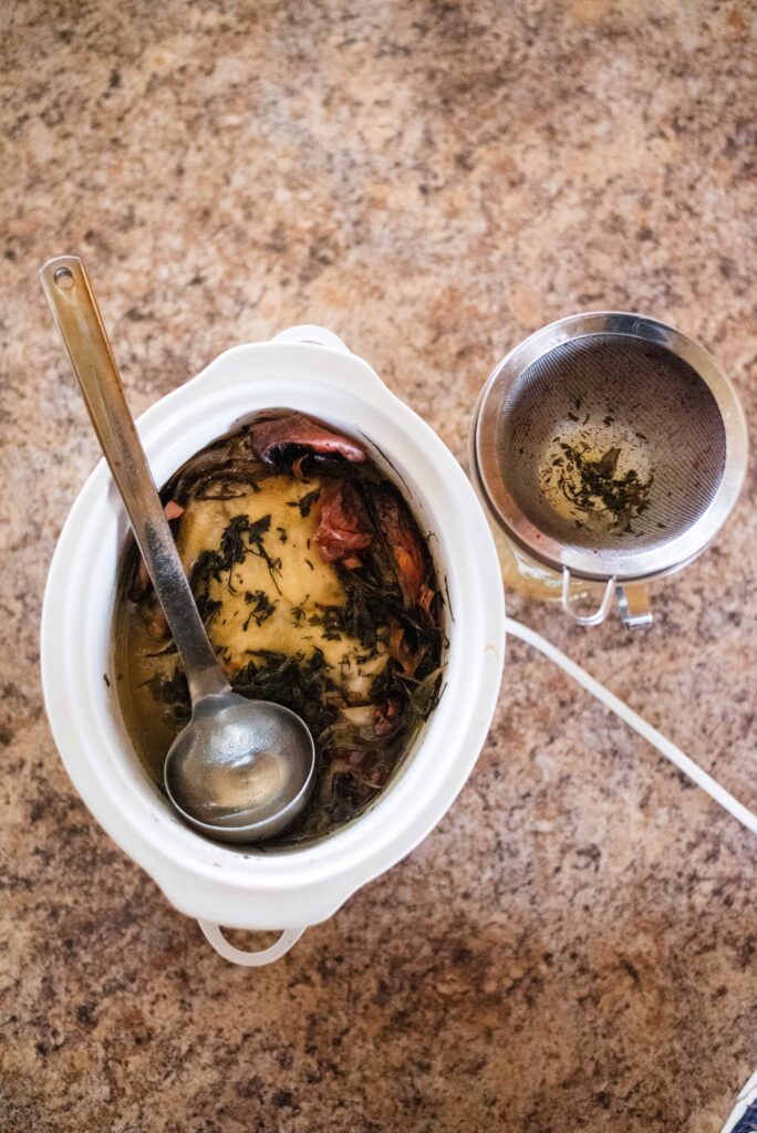 Whole roast chicken and bone broth ready to be filtered