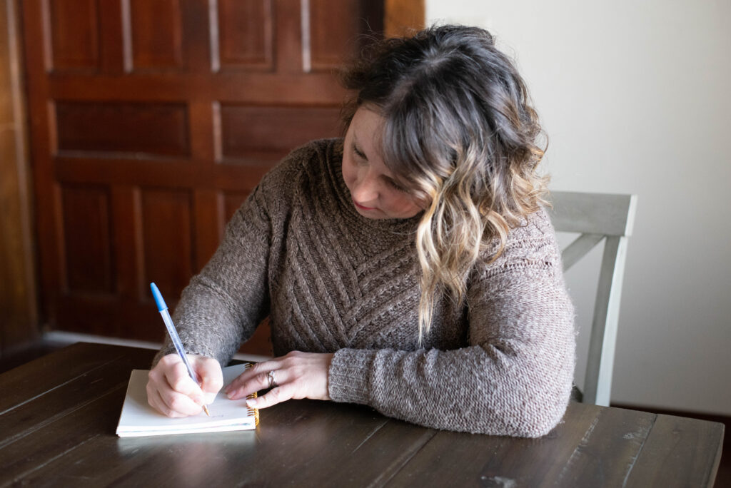 Woman writing an emergency plan