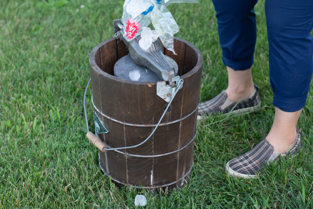 Ice being added to old-fashioned ice cream maker