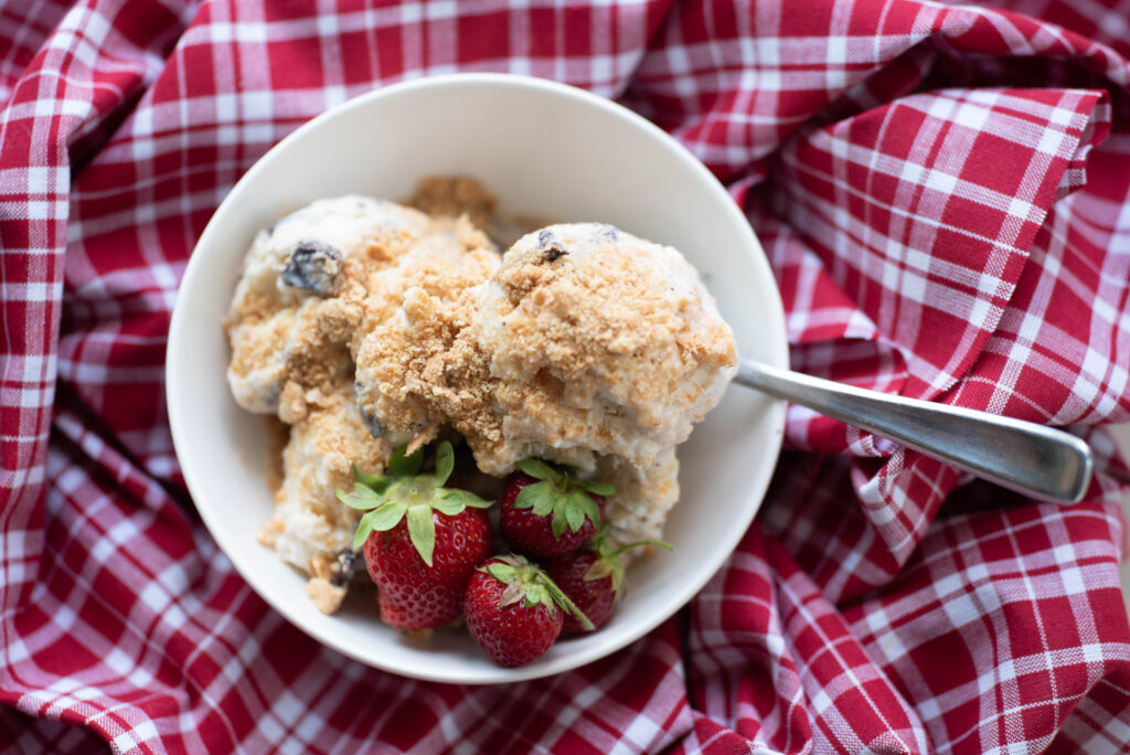 Bowl of ice cream with strawberries.