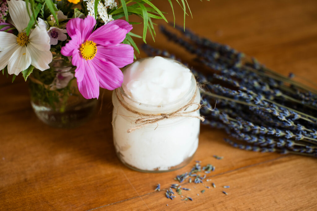 jar of whipped lard with lavender and bouquet of flowers