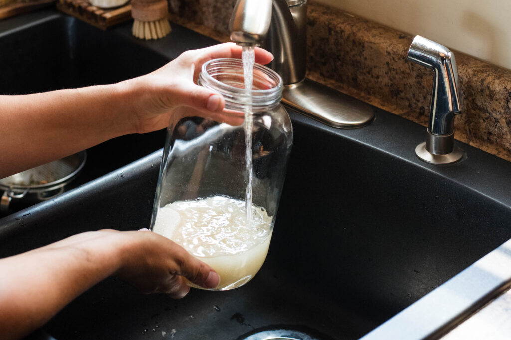 Water being poured in a jar.