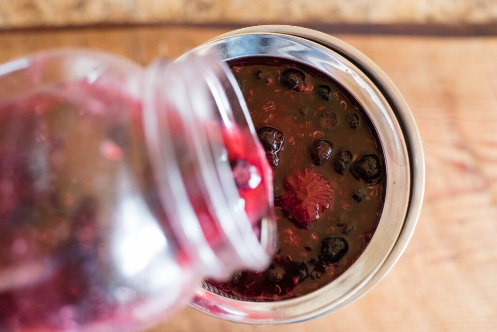 Juice being strained from fruit.