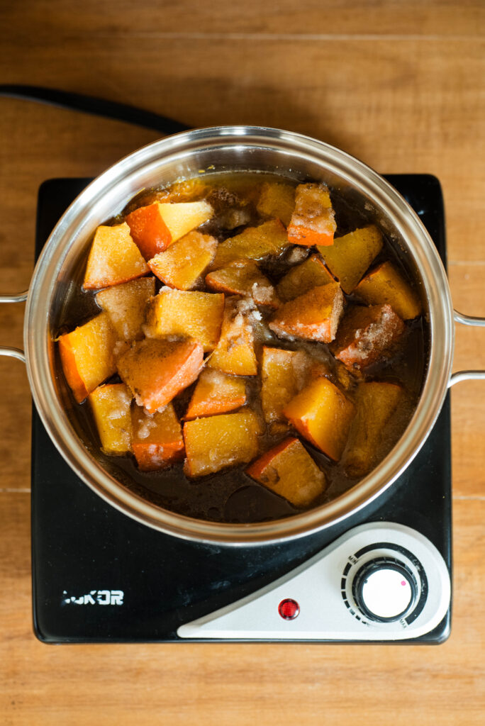 Fresh cubed pumpkin cooking.