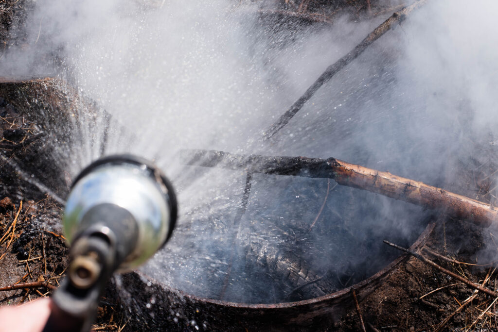 A hose putting out a fire.