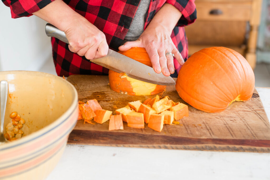 Rind being cut off a pumpkin.