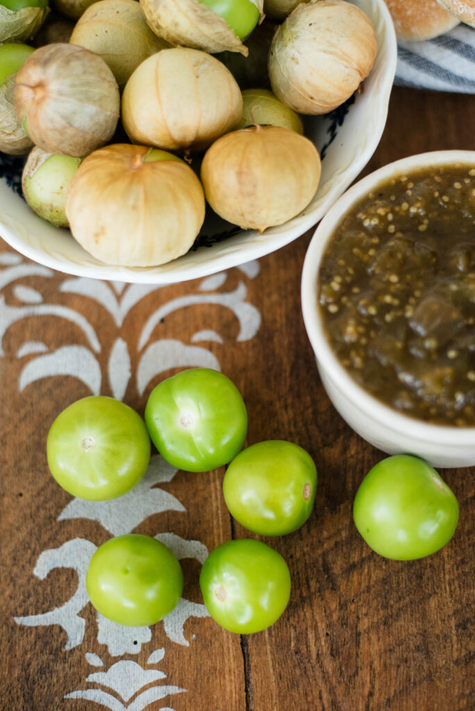 Tomatillo jam and fresh tomatillos in the wrapper and without the wrapper