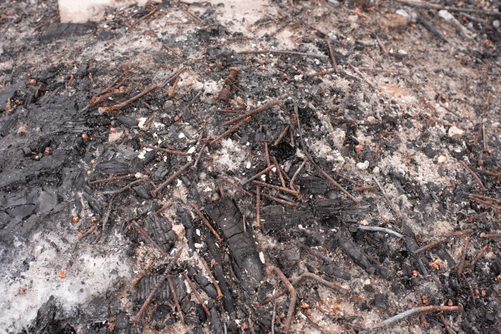 Fire pit area with rusty nails.