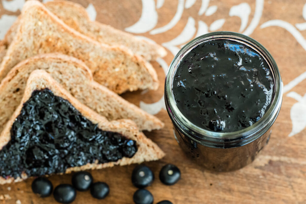 Jam, toast and fresh huckleberries.