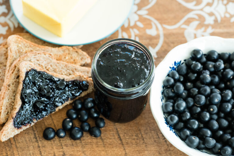 Huckleberry jam with toast, butter and fresh huckleberries