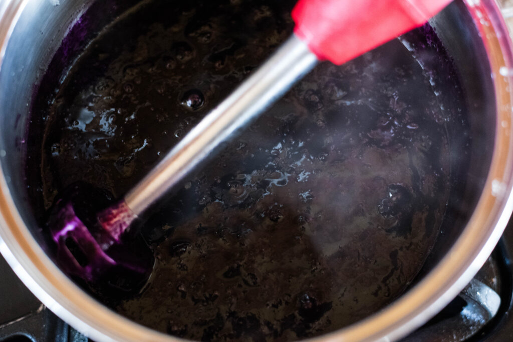Huckleberry jam being pureed.