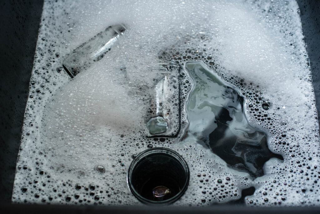 Jars being washed in water.