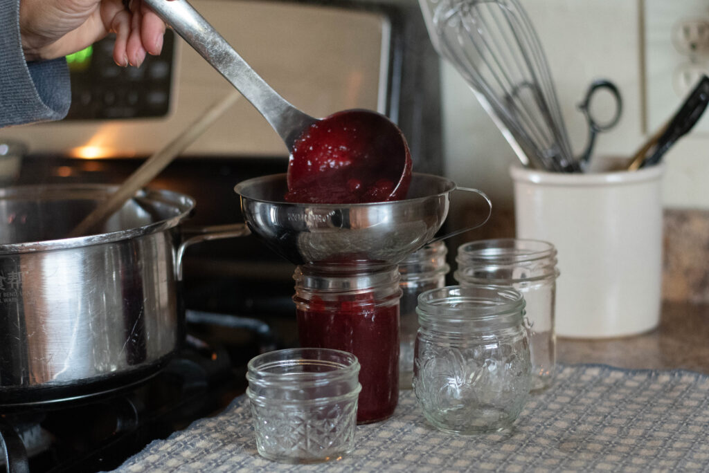 jam ladled into jars