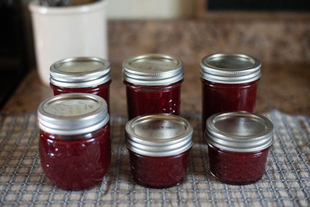 jars of jam resting on towel