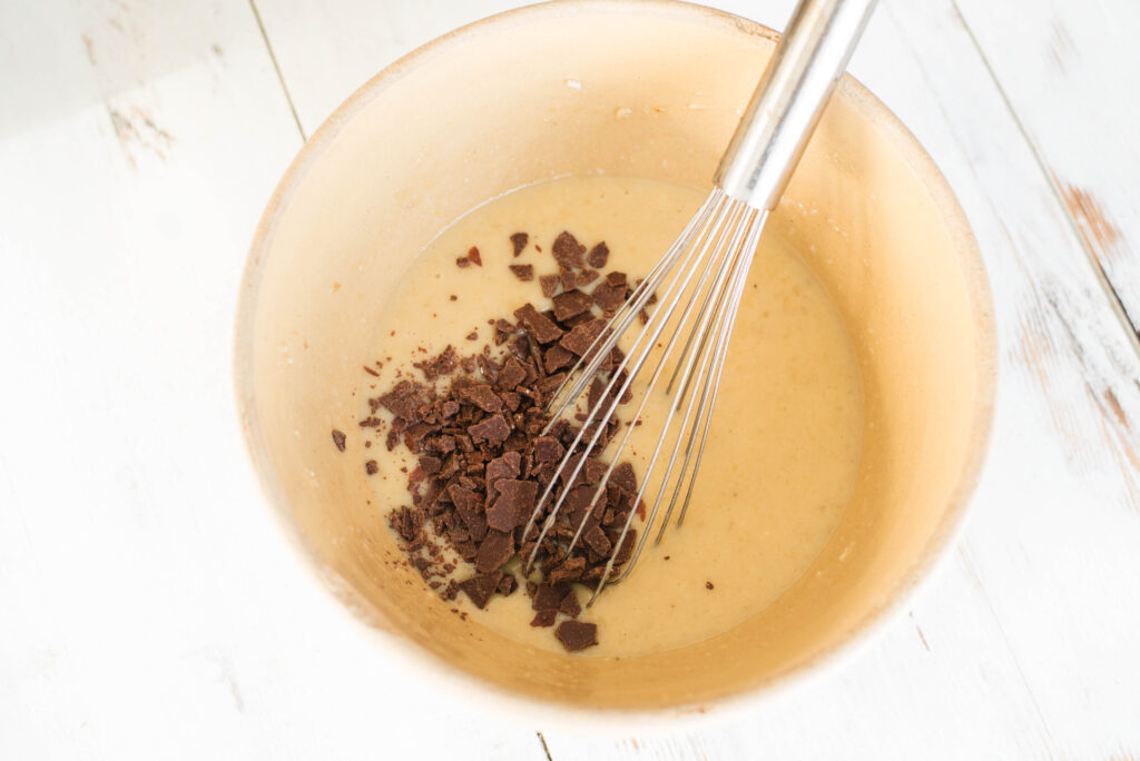 Chocolate chips added to wet ingredients for banana bread