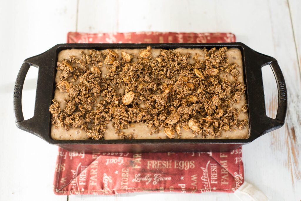 Gluten free banana bread with pumpkin seed crumble before baking