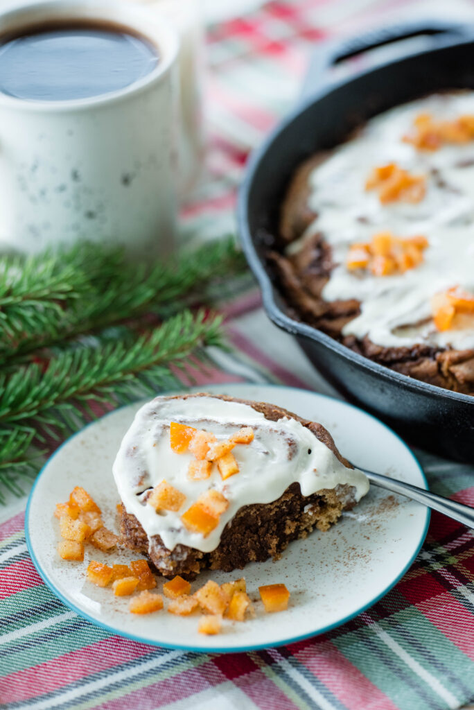 sourdough gingerbread cinnamon rolls on a serving plate