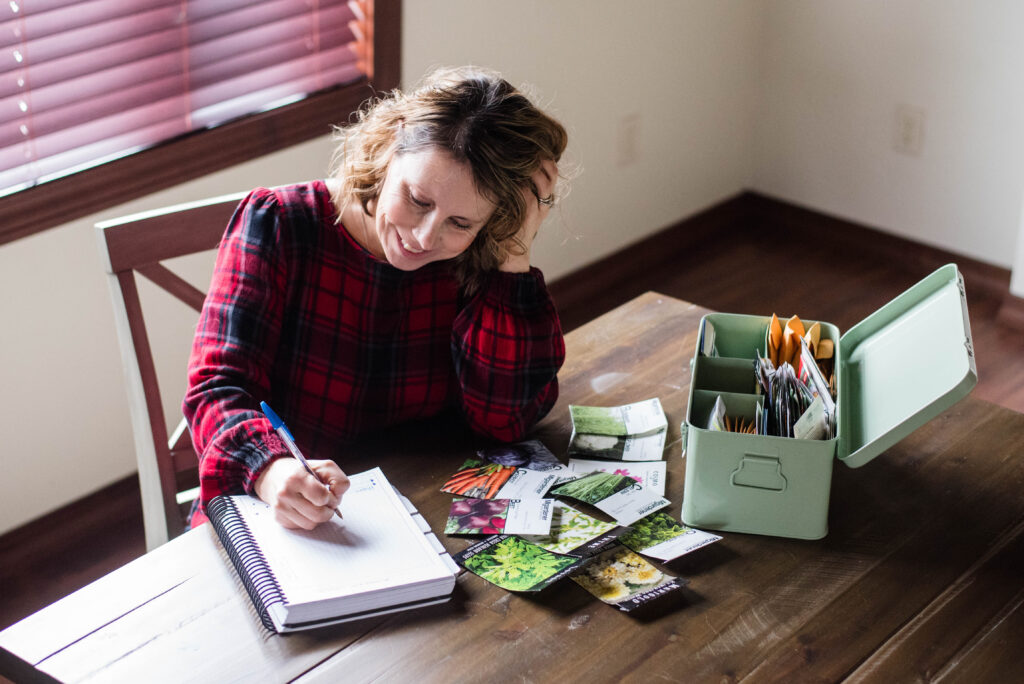 Woman making a yearly garden plan