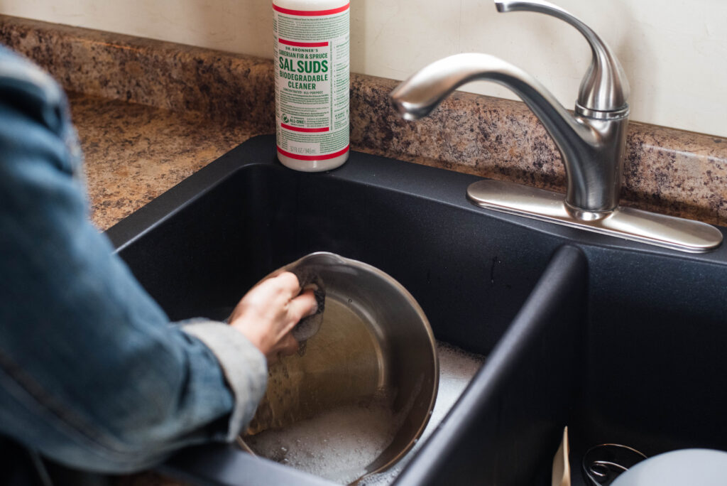 Castile soap being used for non-toxic home cleaning in the kitchen