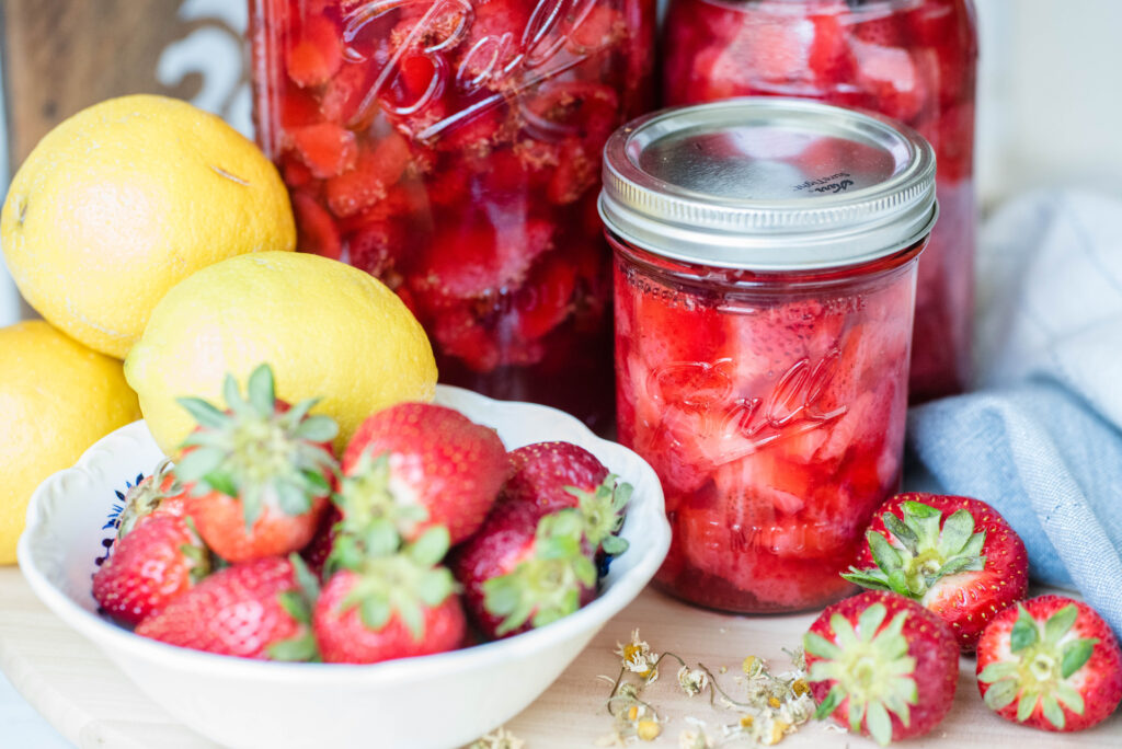 Jars of fermented strawberries with honey