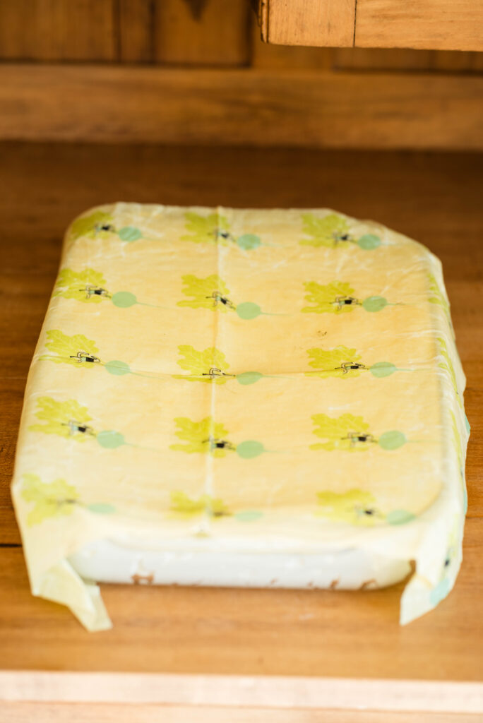 Pan of homemade vanilla ice cream covered.