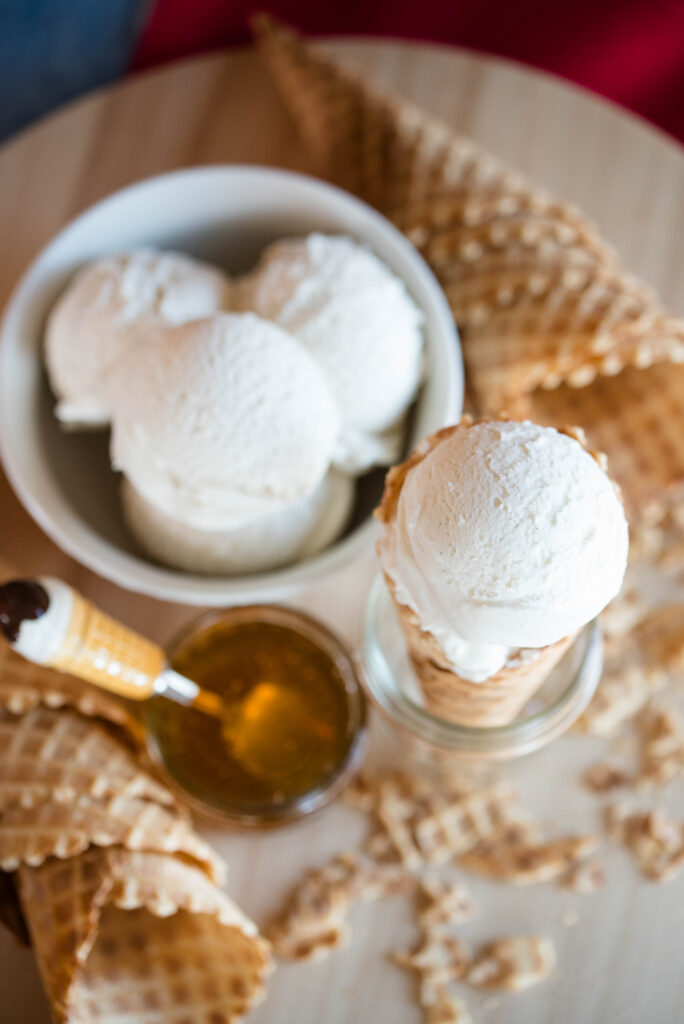 Homemade vanilla ice cream in a waffle cone.