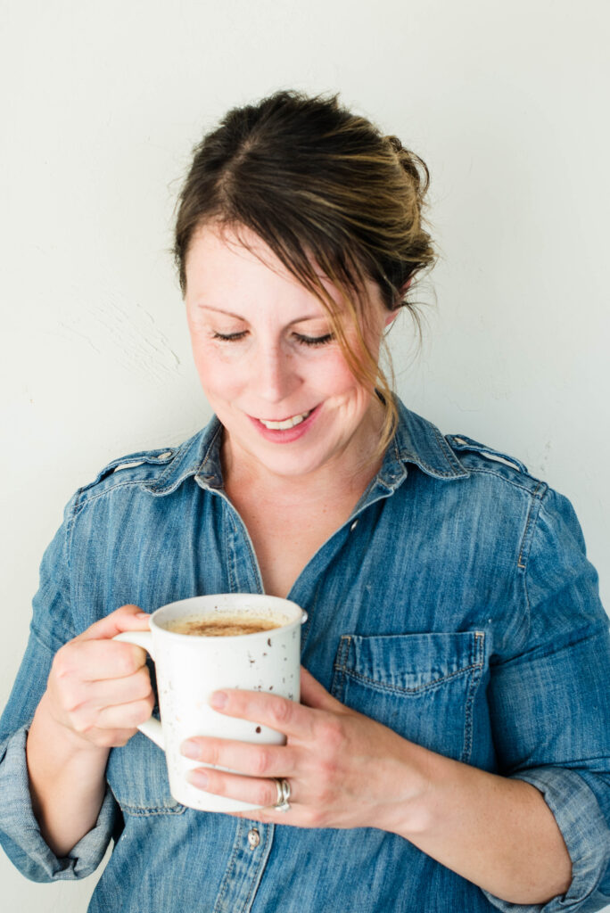 Woman holding warm dandelion root tea latte