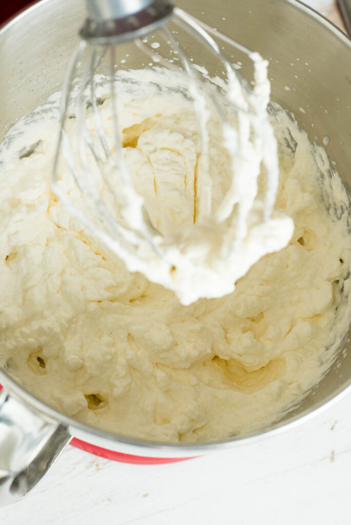 Homemade whipped cream at the stiff peak stage