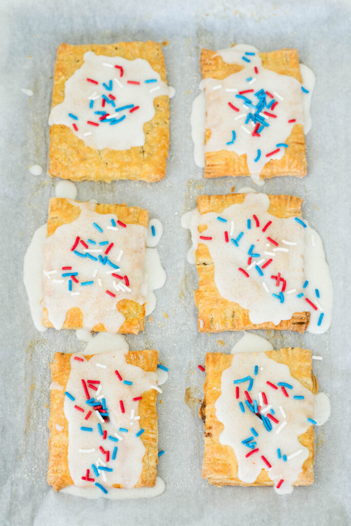 Jam filled pop tarts on a baking sheet