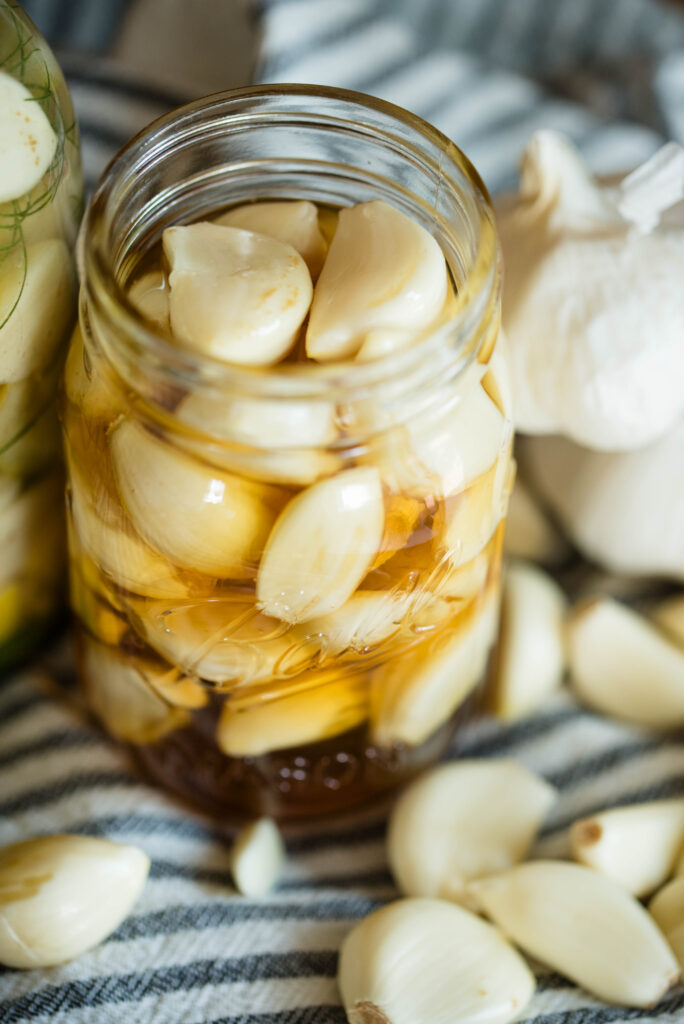 Jar of garlic cloves with honey.