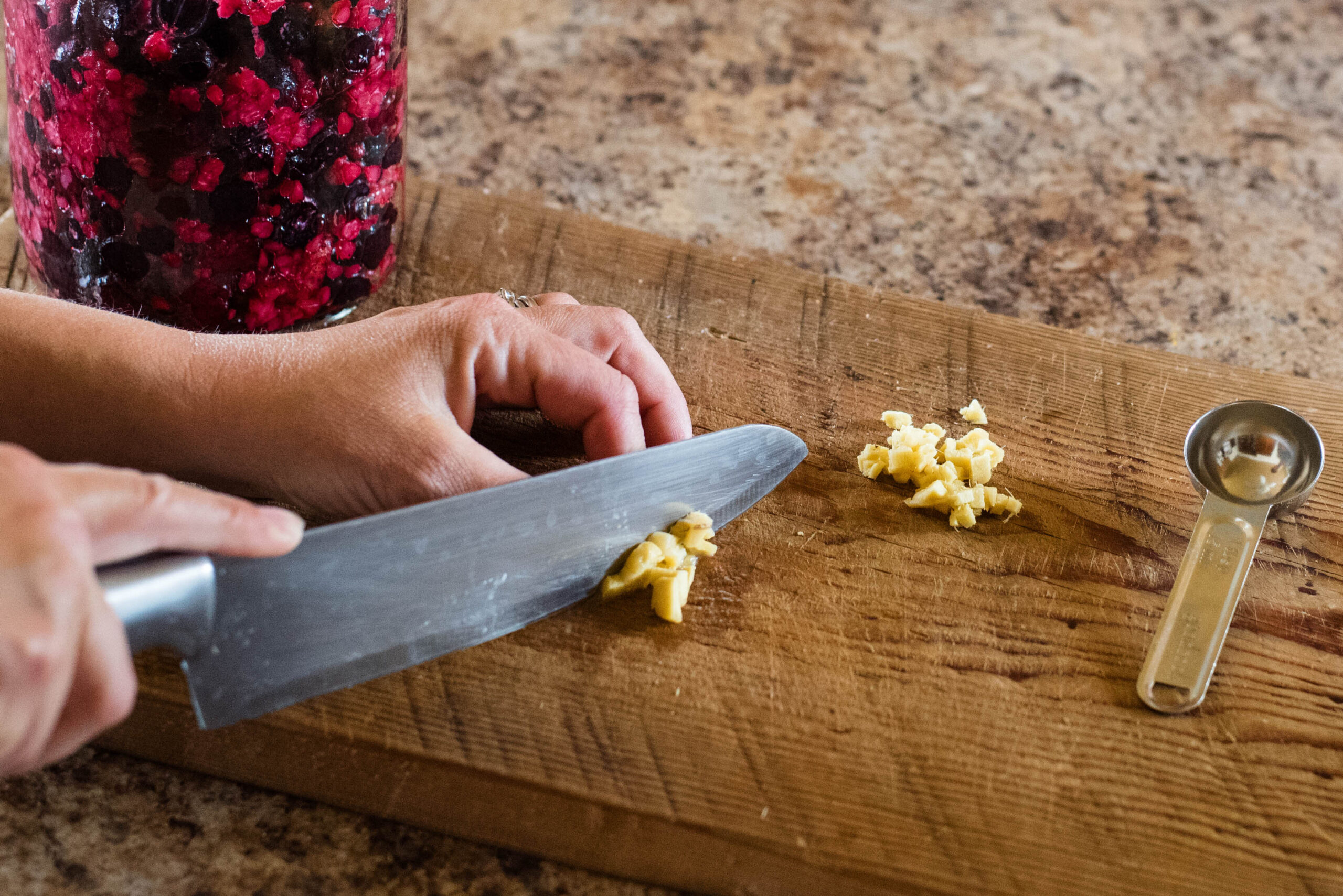Fresh ginger being diced.