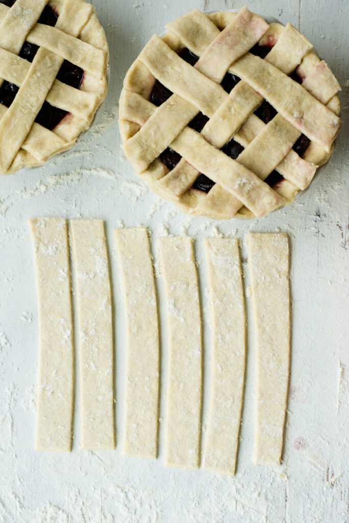 Strips of pie dough for a lattice top crust.