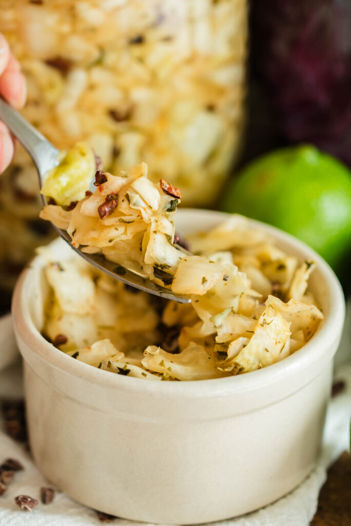 Scoop of sauerkraut on a fork.