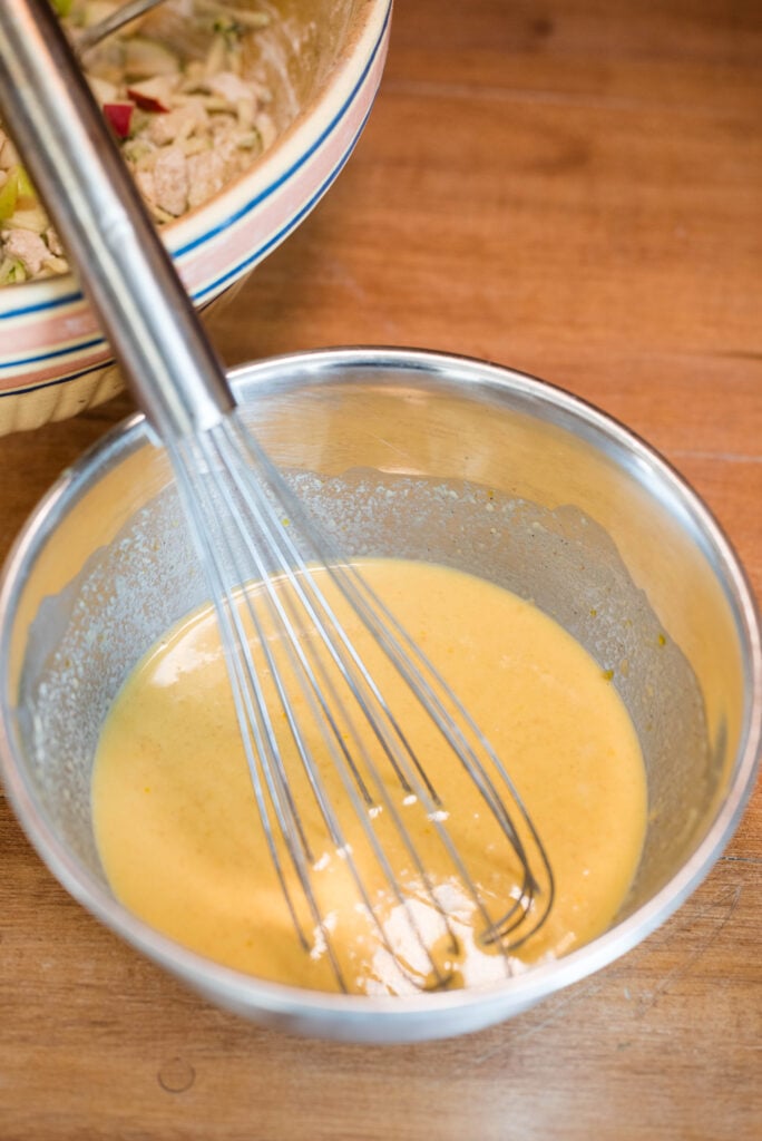 Wet ingredients whisked together for apple spice muffins.