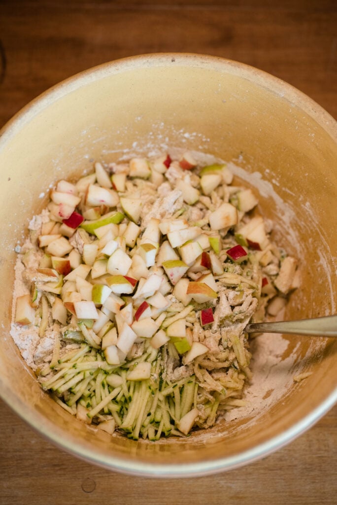 Diced apples and shredded zucchini folded into dry ingredients.