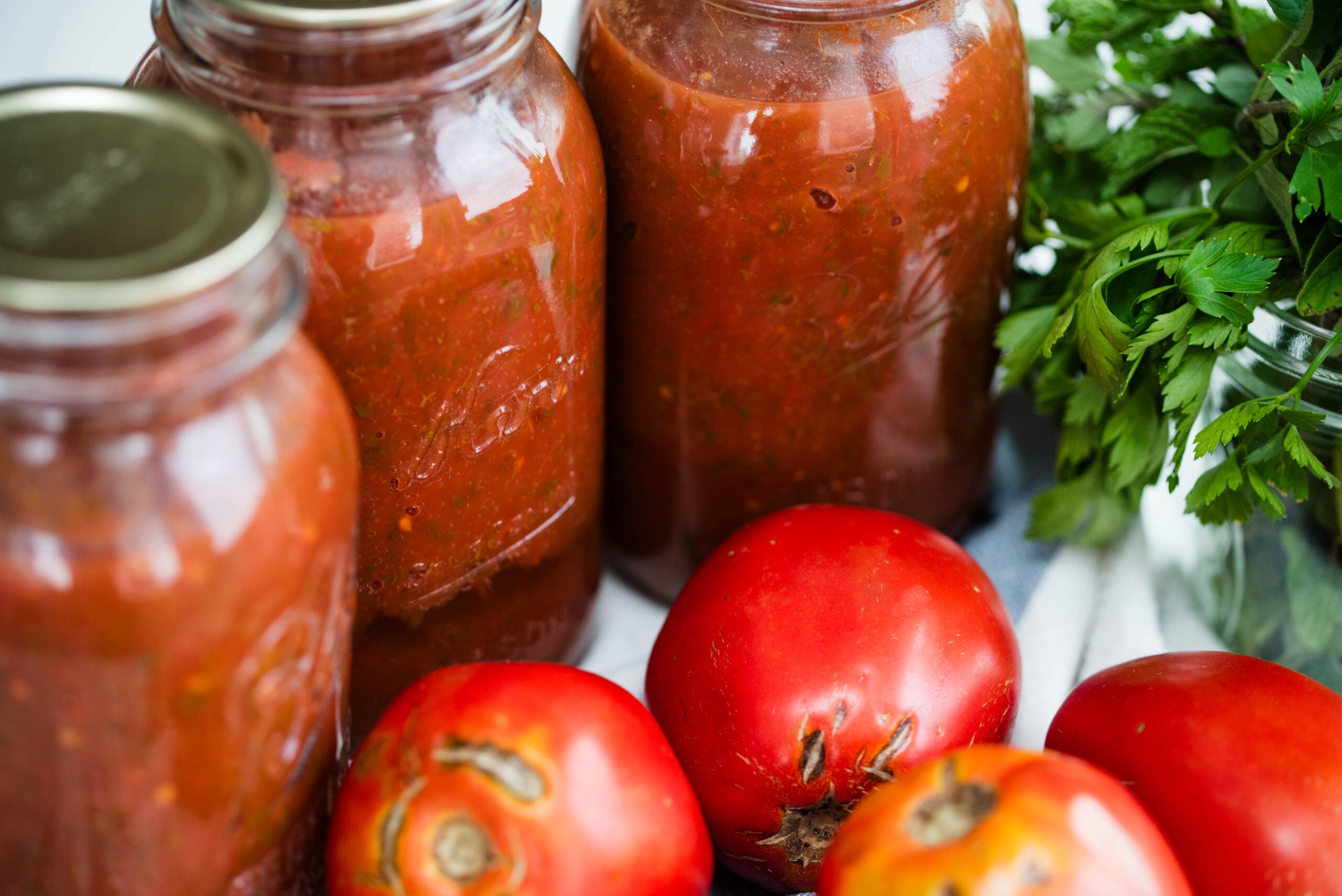Jars of pasta sauce for canning.