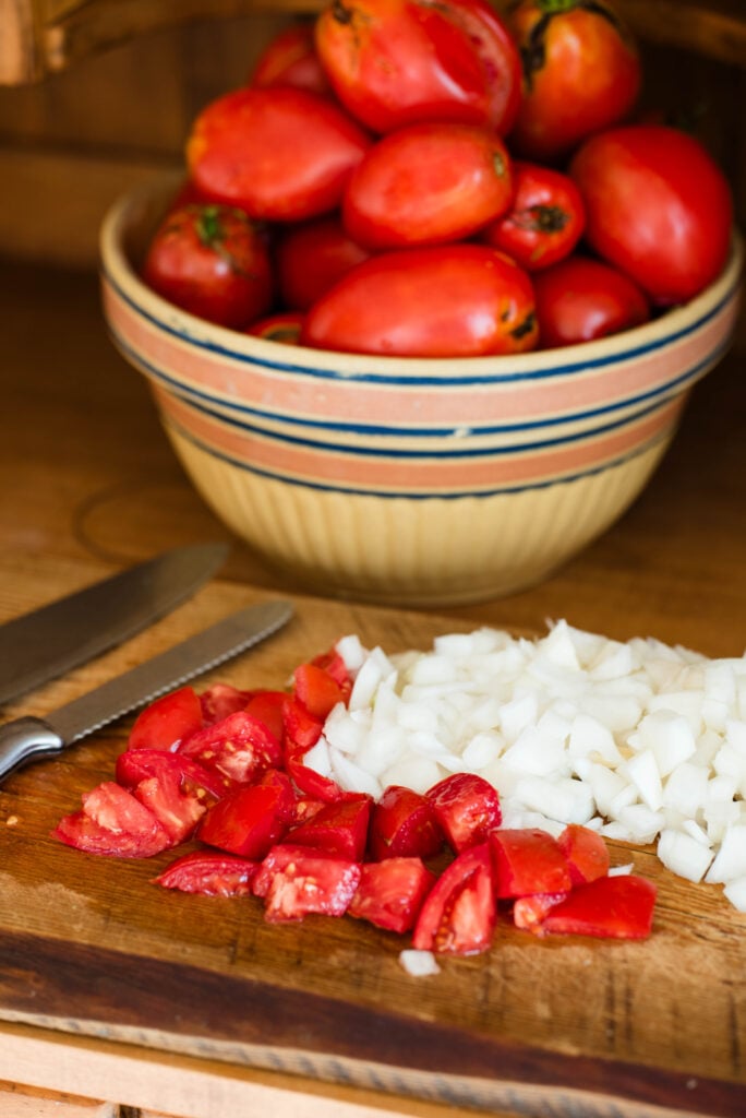 Tomatoes and onions diced for pasta sauce for canning.