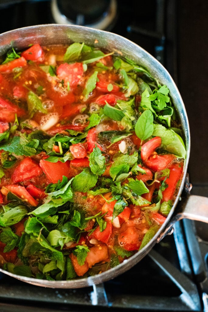 A pot full of ingredients for pasta sauce for canning.