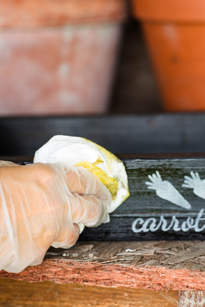 A wood box being sealed with linseed oil.