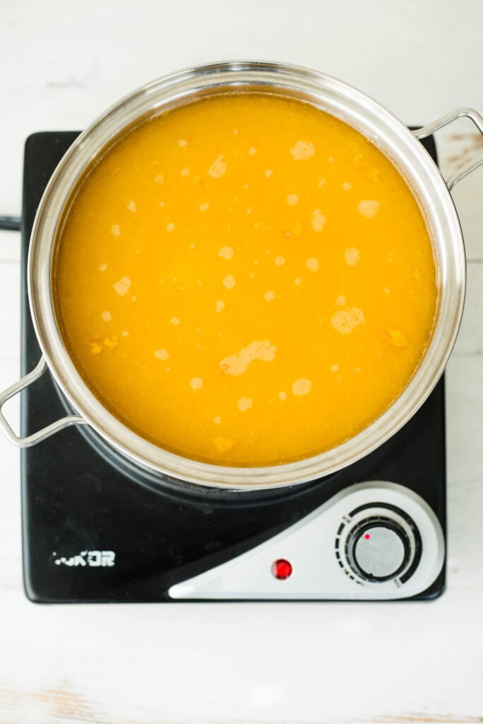 Pumpkin puree simmering with water.