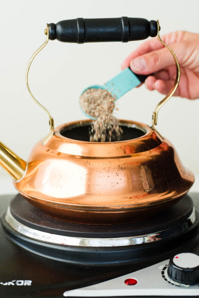 Herbs added to a tea kettle for an herbal pumpkin spice latte.